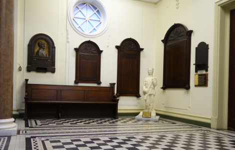 The panels to the left of the main staircase.